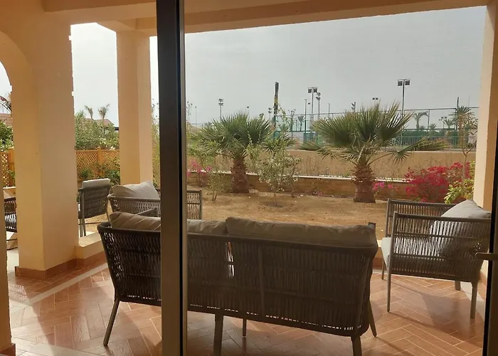 Apartment Golf, & Sea - Serene Garden Patio Getaway